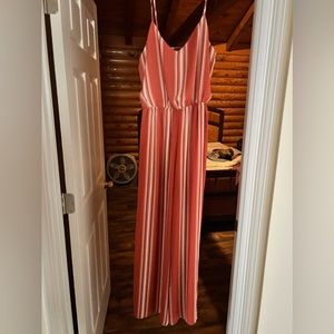 Orange and white romper with slits size large worn once